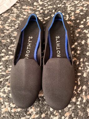 Rothy's Black Slip-On Flats with Blue Lining